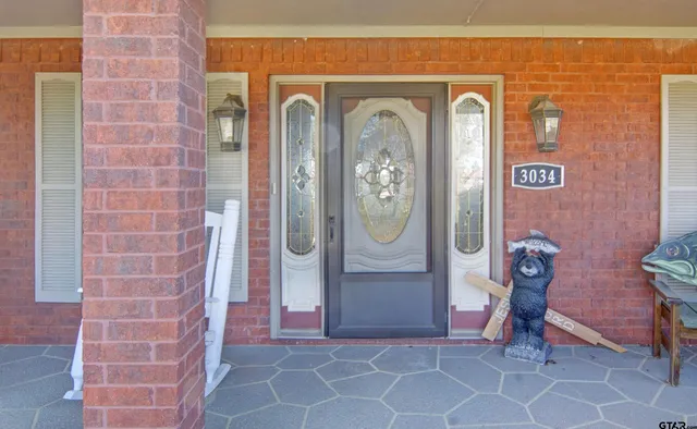 a view of a door and chair in the room