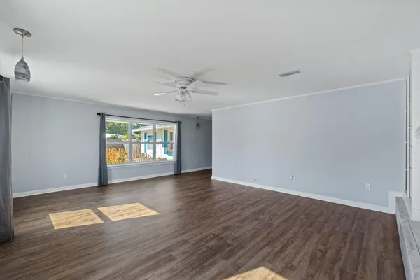 a view of an empty room with a window