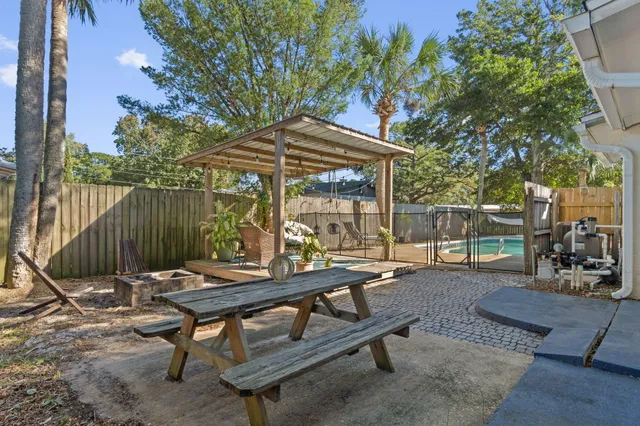 a view of a backyard with a sitting area