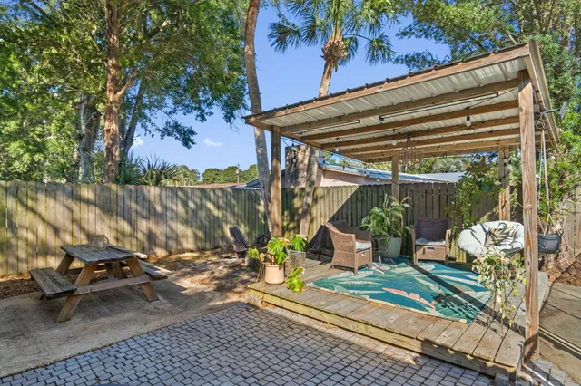 a view of a two chairs in the patio