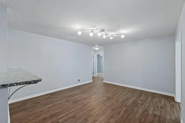 a view of kitchen cabinet and wooden floor
