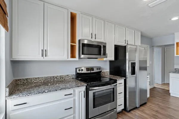 a kitchen with a sink and cabinets
