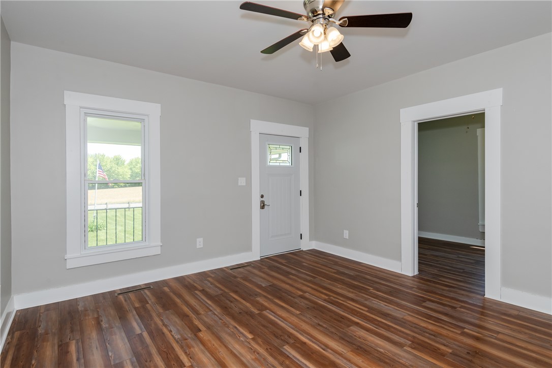 1217 Jasper Road Xenia, OH 45385 - Photo 29 of 62 This bright room features durable flooring and a stylish entry door, perfect for comfortable living.