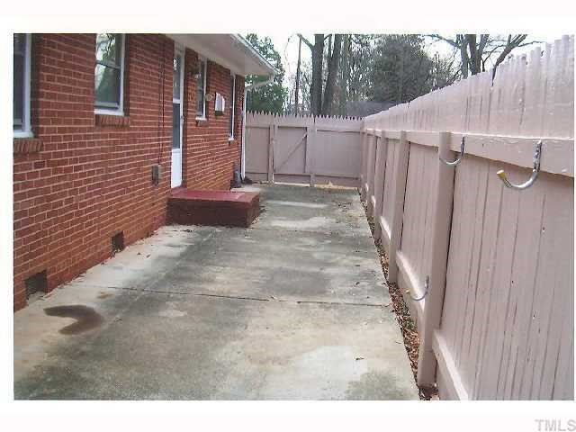 2913 Bardwell Road Raleigh, NC 27604 - Photo 2 of 7 a view of a backyard with pathway