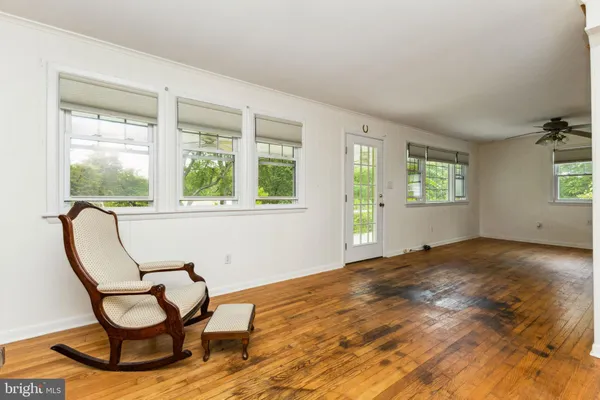 a view of a livingroom with furniture and window