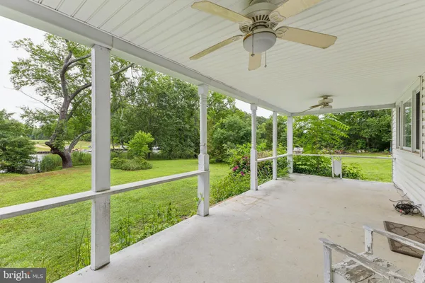 a view of a porch with a yard
