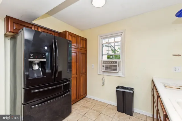 a kitchen with stainless steel appliances a refrigerator and a stove
