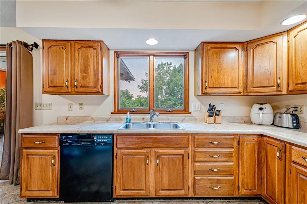 257 Fallen Timber Road Avella, PA 15312 - Photo 11 of 32 a kitchen with granite countertop cabinets sink and window