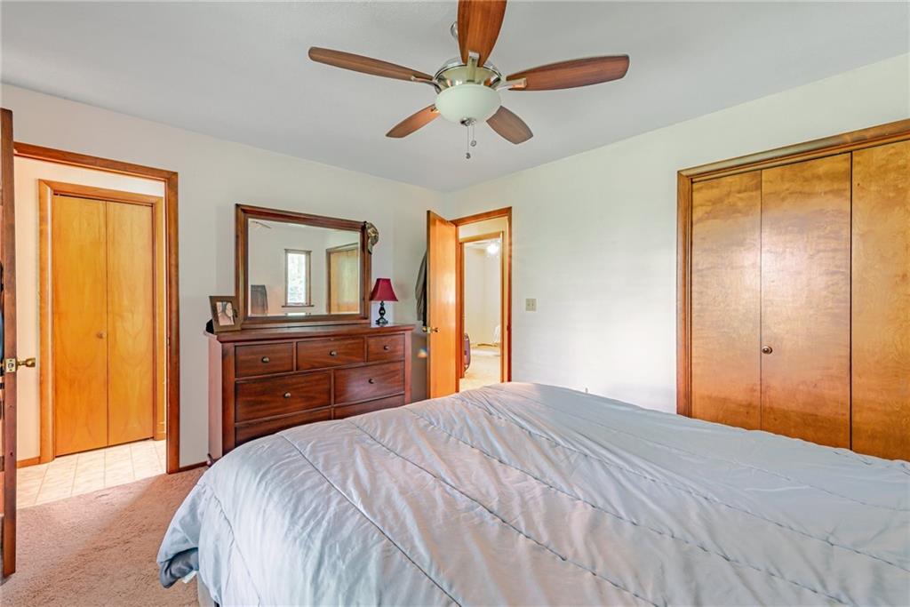 257 Fallen Timber Road Avella, PA 15312 - Photo 13 of 32 a bedroom with a bed and a dresser