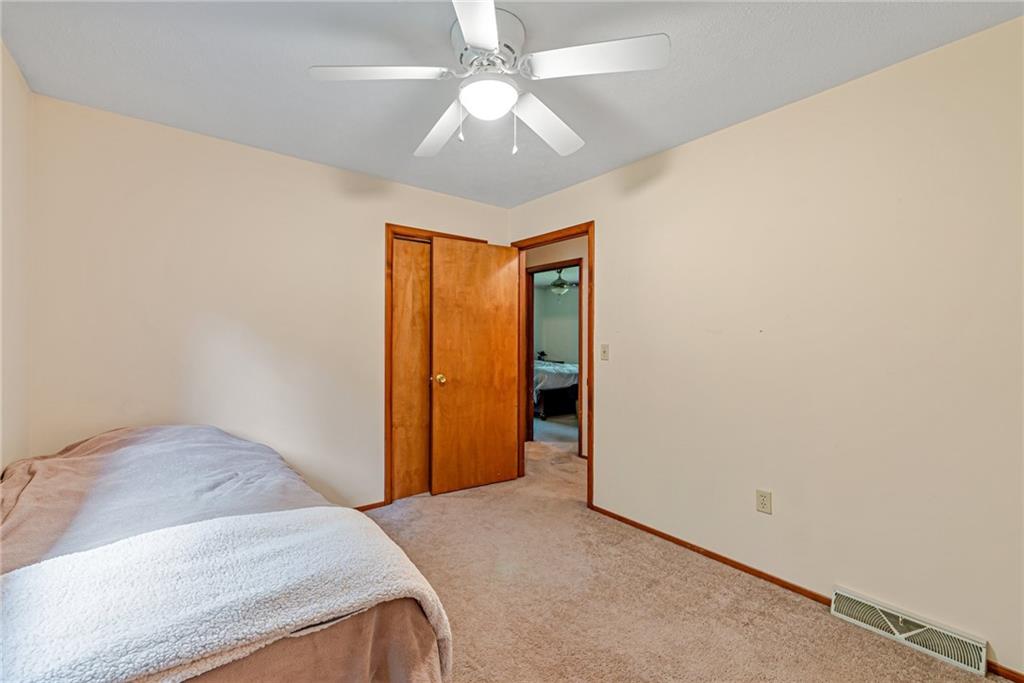 257 Fallen Timber Road Avella, PA 15312 - Photo 16 of 32 an empty room with a ceiling fan and closet