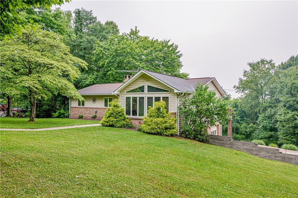 257 Fallen Timber Road Avella, PA 15312 - Photo 2 of 32 a front view of a house with garden