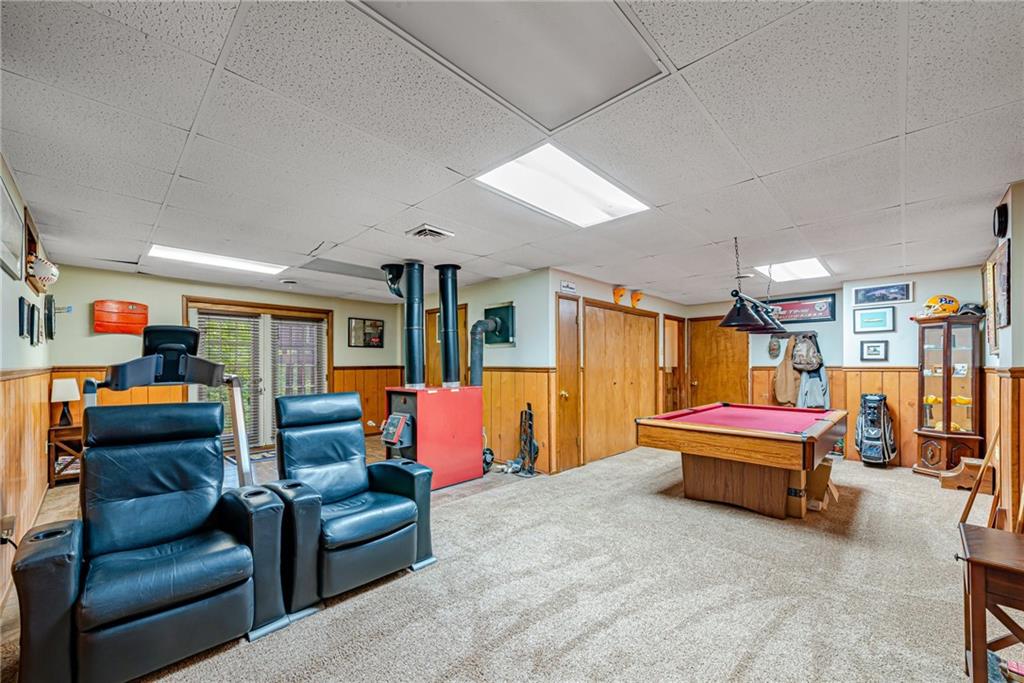 257 Fallen Timber Road Avella, PA 15312 - Photo 22 of 32 a living room with furniture gym equipment and a flat screen tv