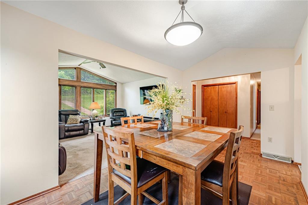 257 Fallen Timber Road Avella, PA 15312 - Photo 7 of 32 a view of a dining room and livingroom with furniture wooden floor and a rug
