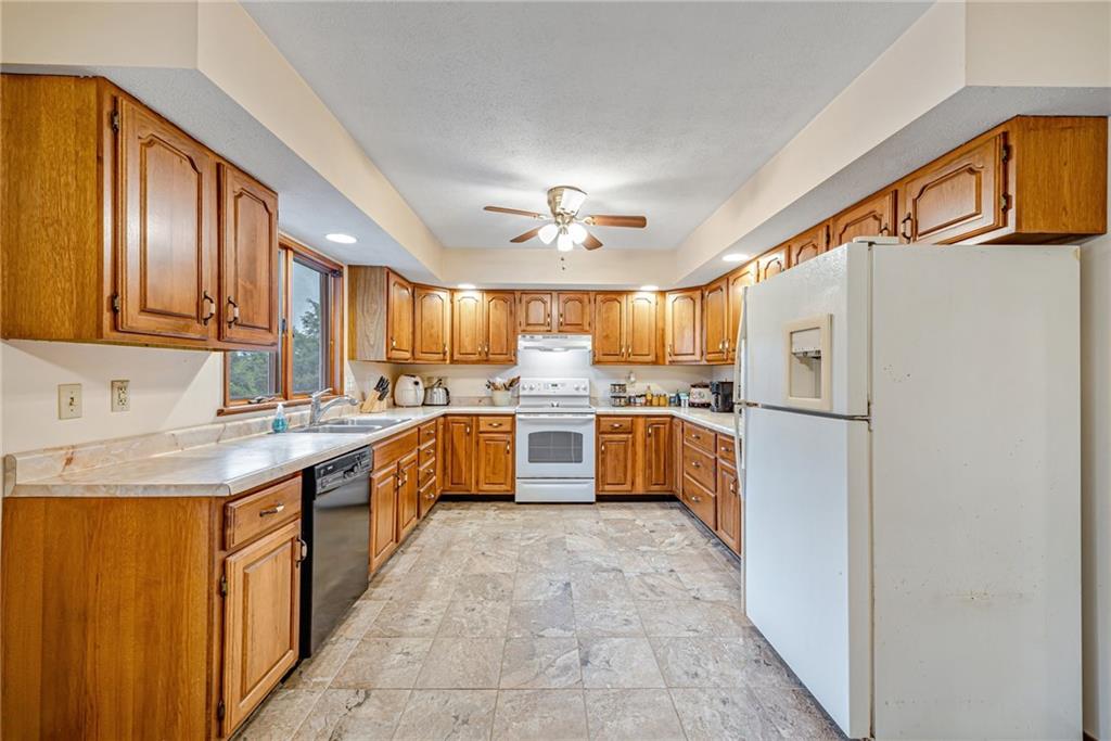 257 Fallen Timber Road Avella, PA 15312 - Photo 8 of 32 a kitchen with stainless steel appliances a sink and a refrigerator