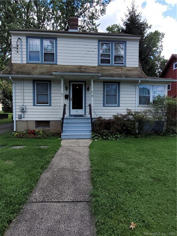 49 Robbins Drive Wethersfield, CT 06109 - Photo 1 of 1 a front view of a house with a garden and yard
