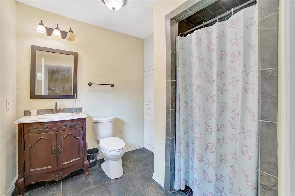 6021 Sycamore Creek Road Edgecliff Village, TX 76134 - Photo 21 of 37 Bathroom with vanity, toilet, curtained shower, and tile patterned floors