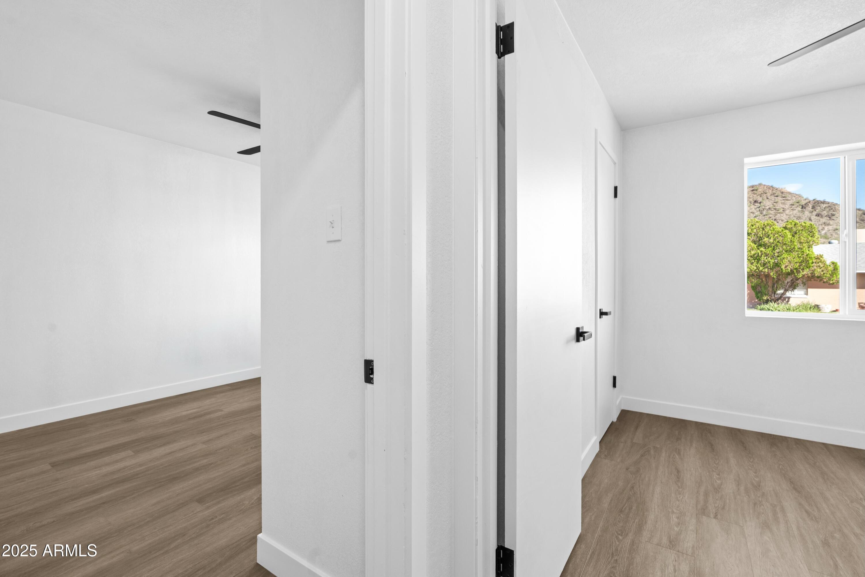 901 West Mercer Lane Phoenix, AZ 85029 - Photo 36 of 40 a view of hallway with wooden floor