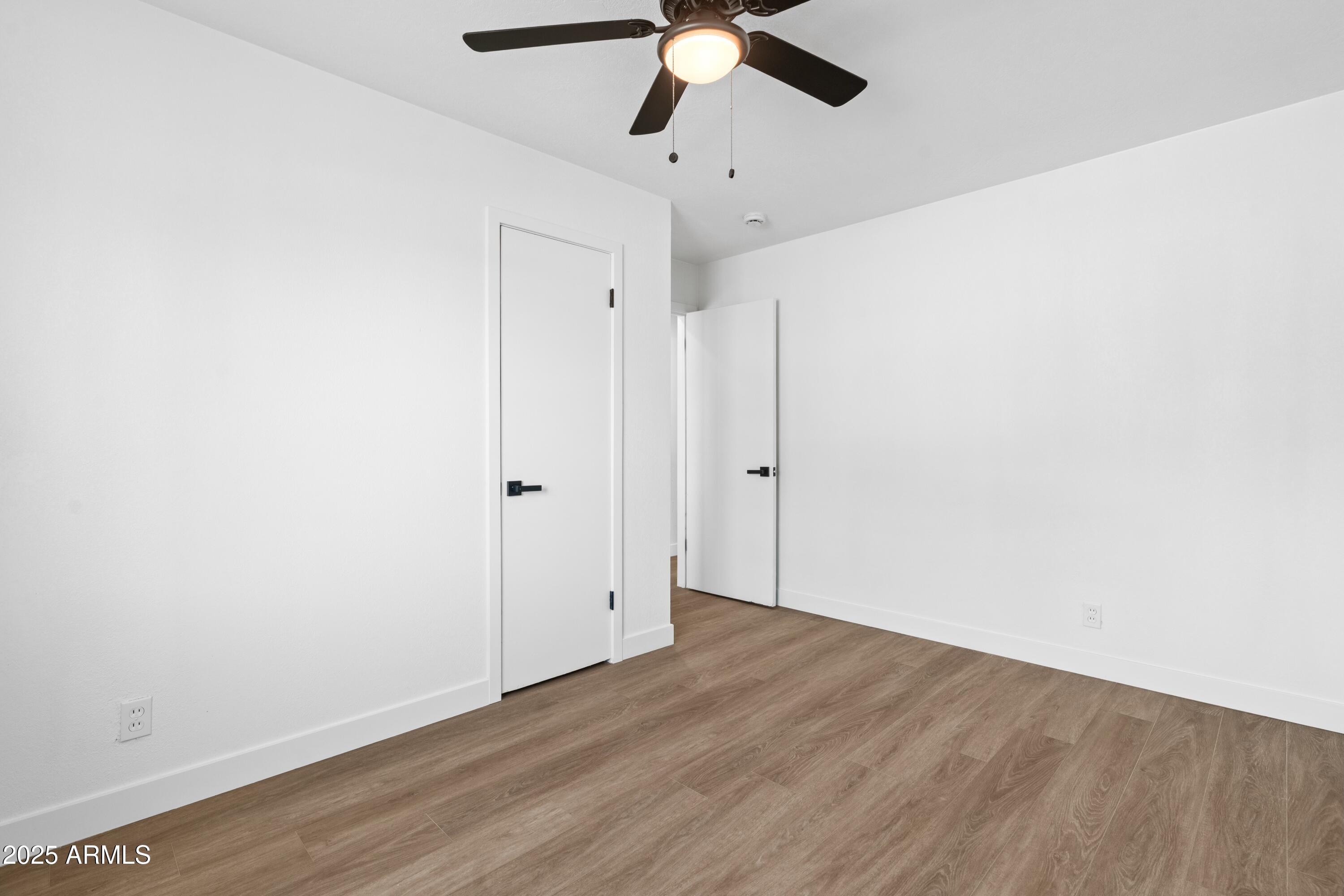 901 West Mercer Lane Phoenix, AZ 85029 - Photo 38 of 40 a view of empty room with wooden floor