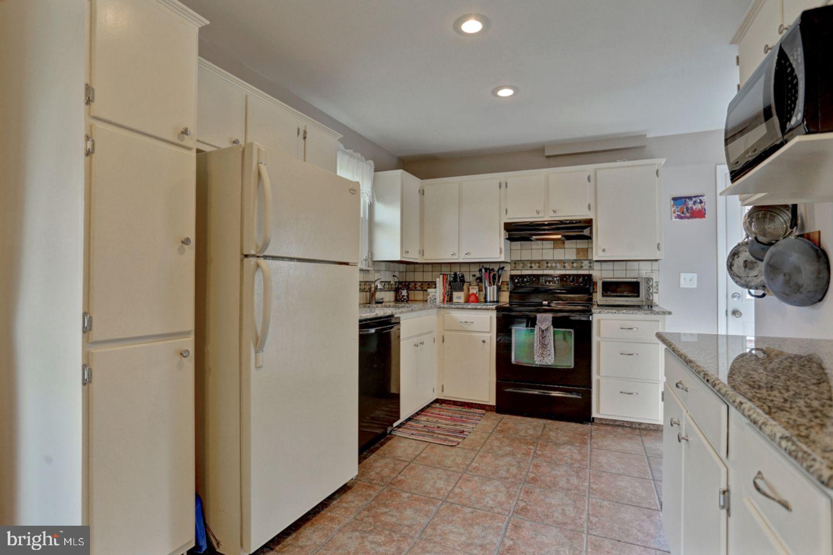 807 Cameron Street Reading, PA 19607 - Photo 13 of 32 Kitchen-Tiled Floor And Back Splash
