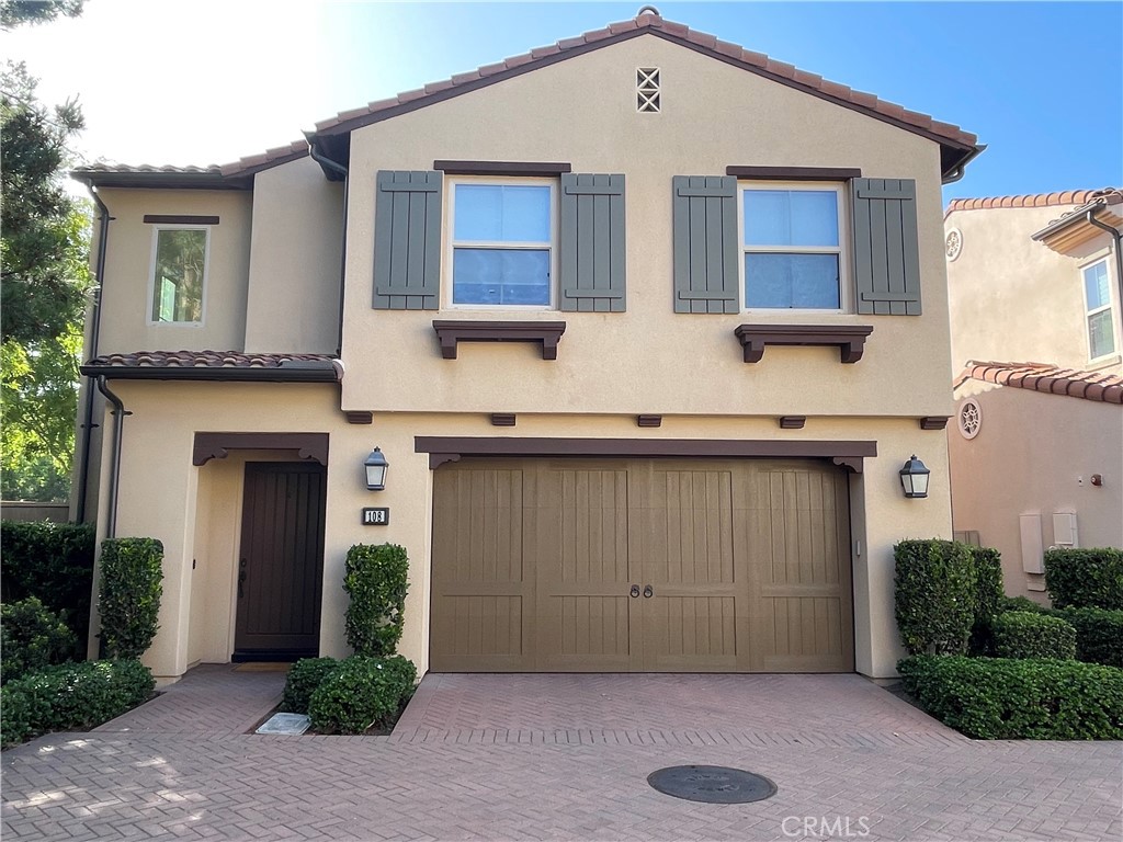 108 Pendant Irvine, CA 92620 - Photo 2 of 36 a front view of a house with yard