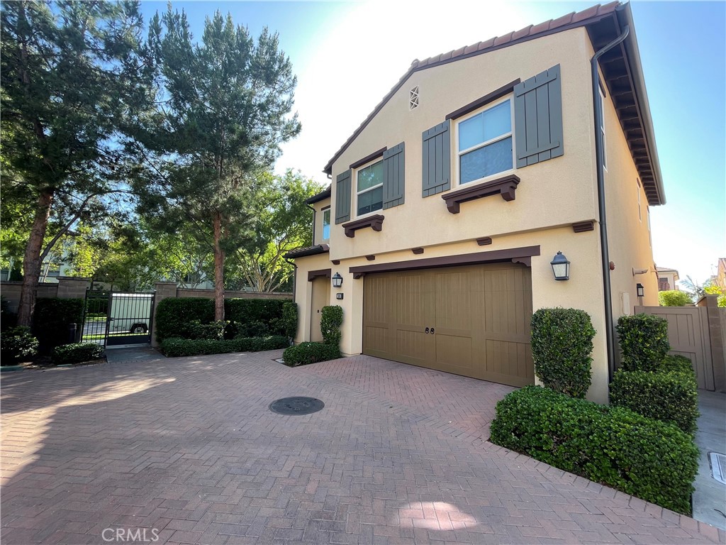 108 Pendant Irvine, CA 92620 - Photo 3 of 36 a view of a house with a garage