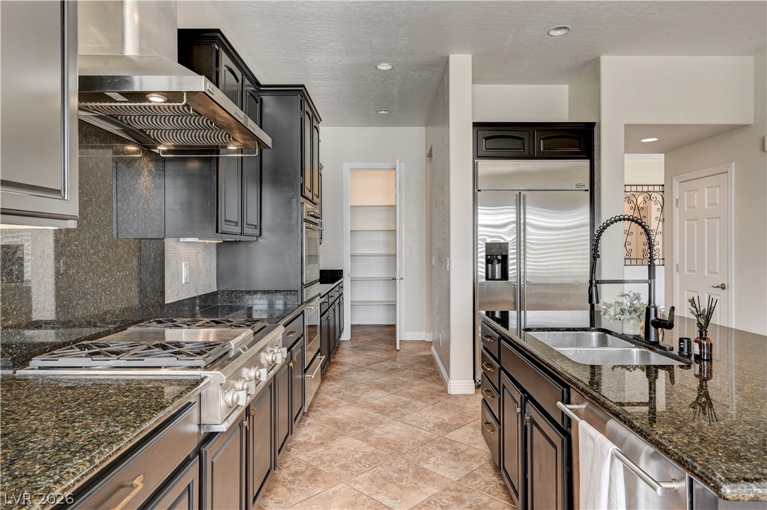 2793 Rosenhearty Drive Henderson, NV 89044 - Photo 23 of 77 Culinary aspirations come alive in this kitchen, featuring ample counter space and modern appliances.