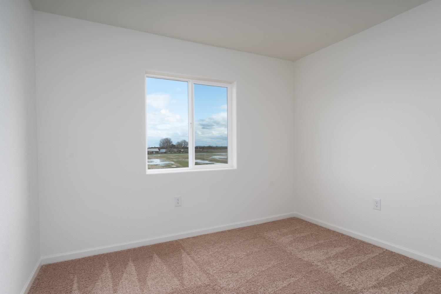 2289 Travis Court Newman, CA 95360 - Photo 16 of 21 an empty room with a window