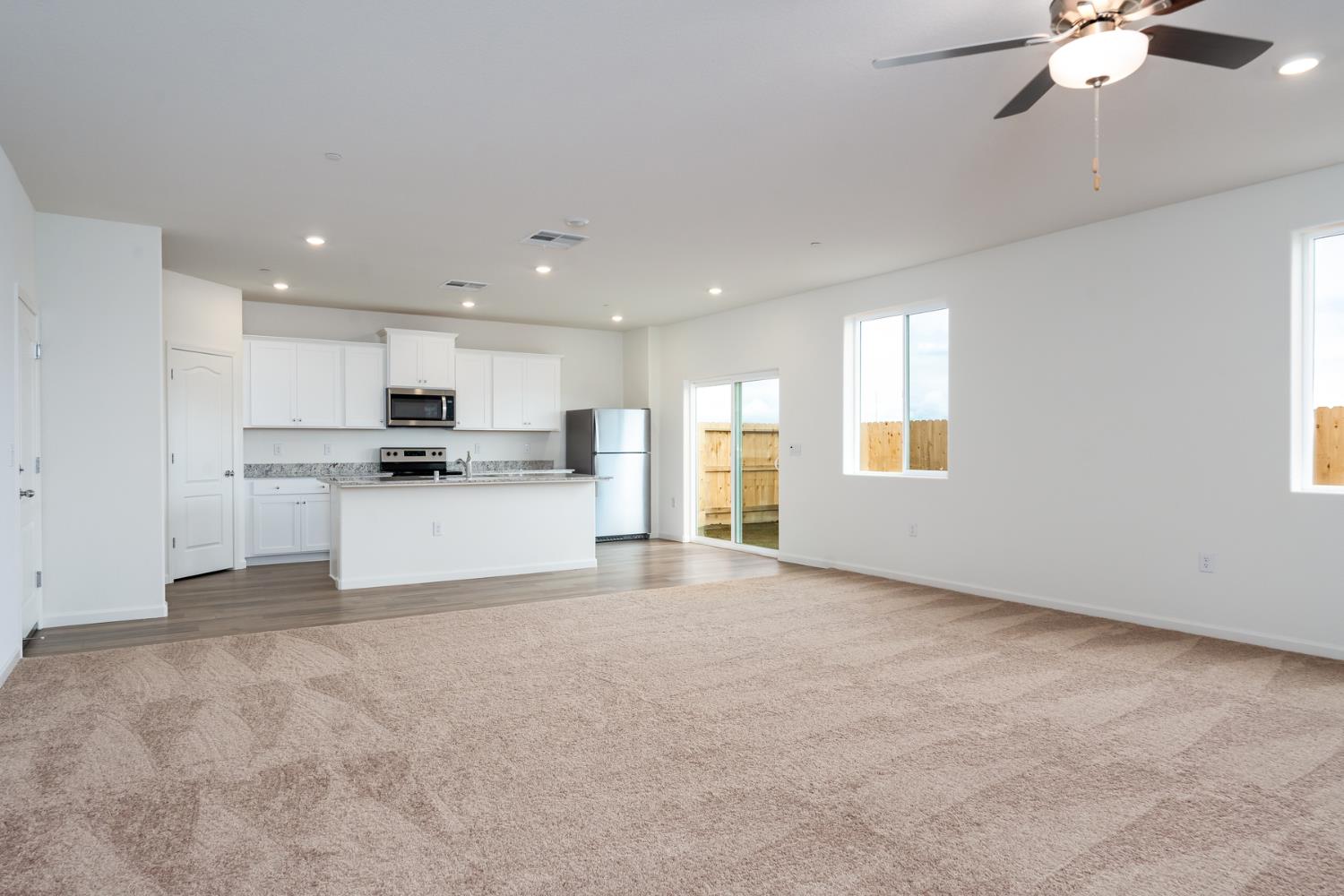 2289 Travis Court Newman, CA 95360 - Photo 8 of 21 a view of kitchen with refrigerator and window