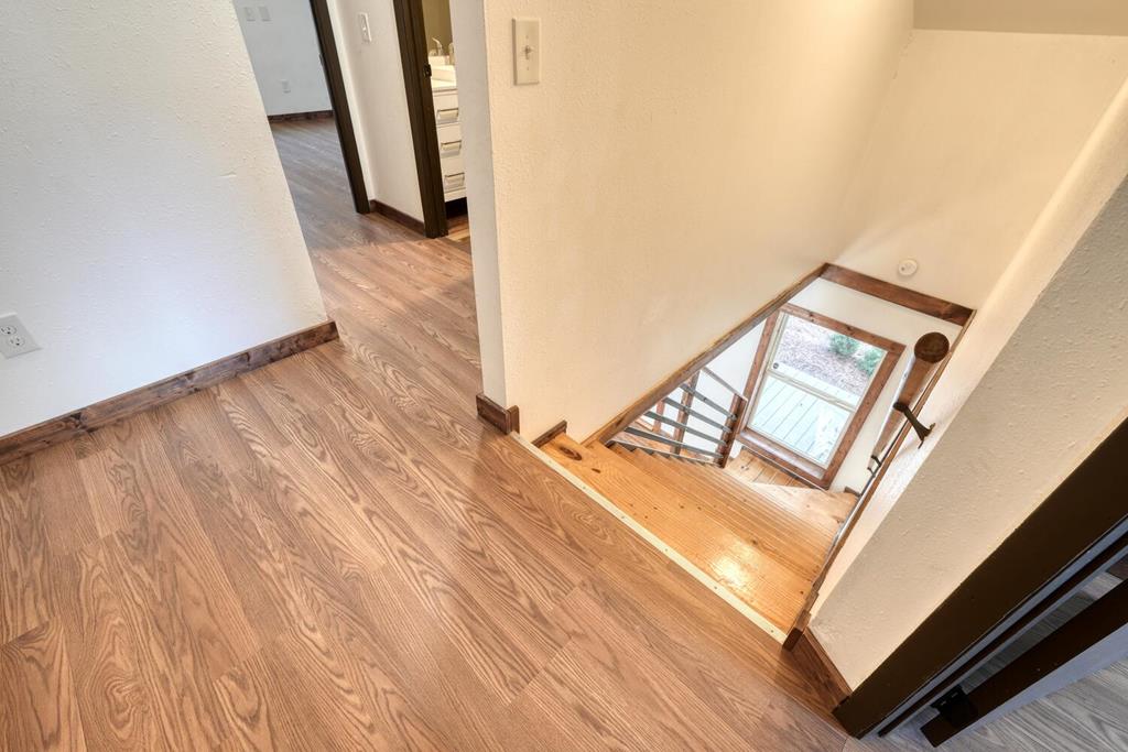 734 Bell Creek Road Hiawassee, GA 30546 - Photo 17 of 30 a view of a hallway with wooden floor and stairs