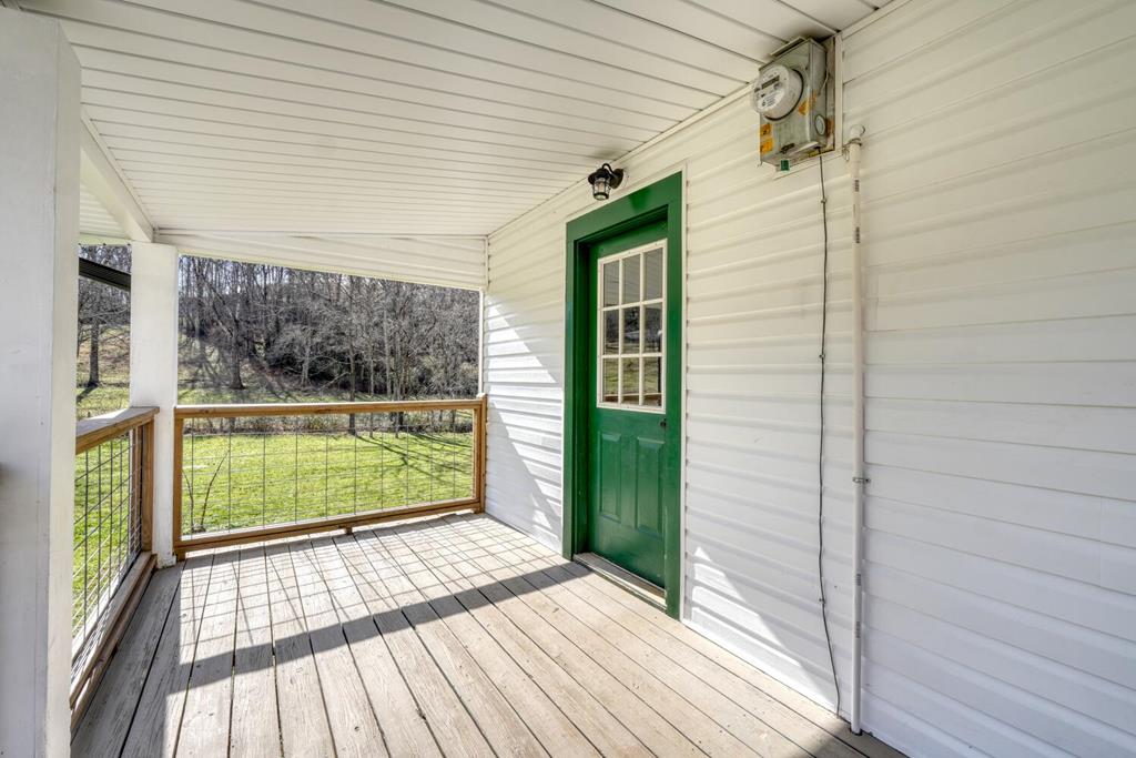 734 Bell Creek Road Hiawassee, GA 30546 - Photo 27 of 30 a view of a balcony with wooden floor