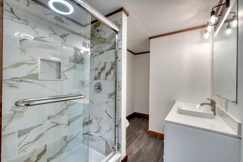 734 Bell Creek Road Hiawassee, GA 30546 - Photo 10 of 30 a bathroom with a sink and shower