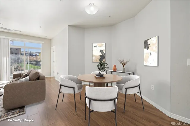 a view of a dining room with furniture and wooden floor