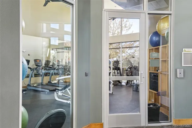 a view of a living room and a balcony