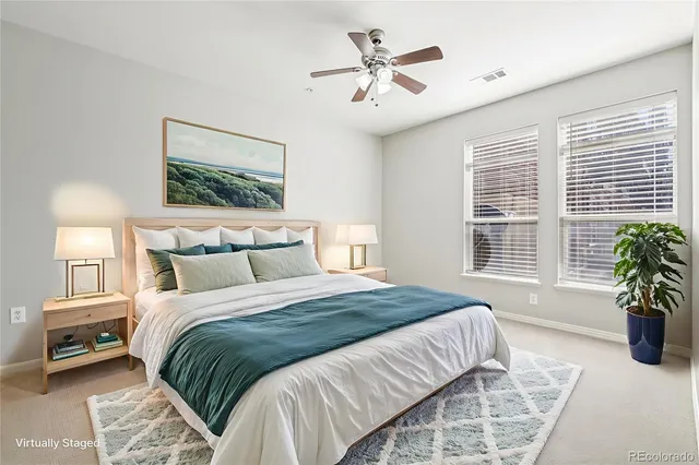 a bedroom with a large bed and a window