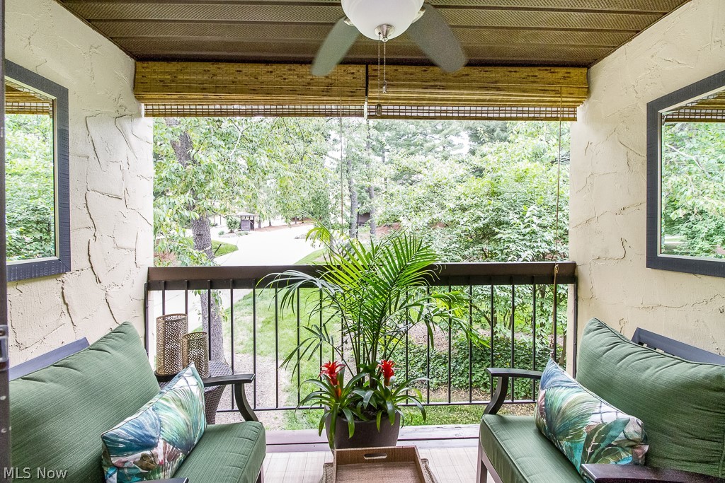 Gorgeous outdoor, private balcony complete with ceiling fan and sun shades.