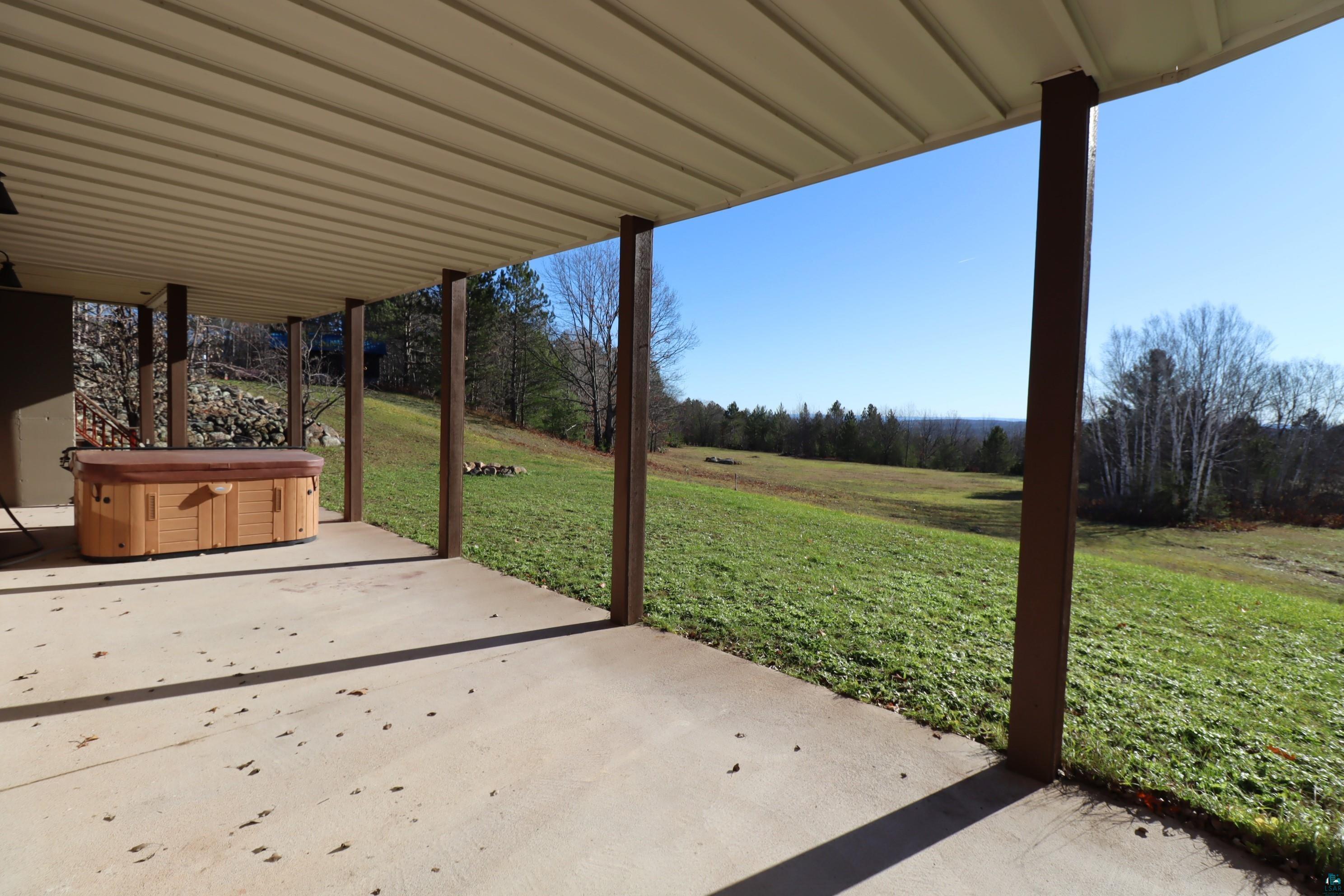 29085 Friendly Valley Road Washburn, WI 54891 - Photo 27 of 48 Lower Level Patio & Hot Tub