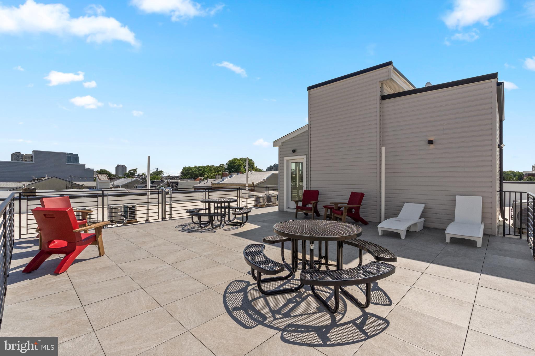 300 Christian Street, Unit 202 Philadelphia, PA 19147 - Photo 23 of 27 a view of a patio with couches and table and chairs and potted plants