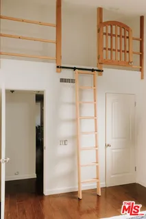 an empty room with wooden floor