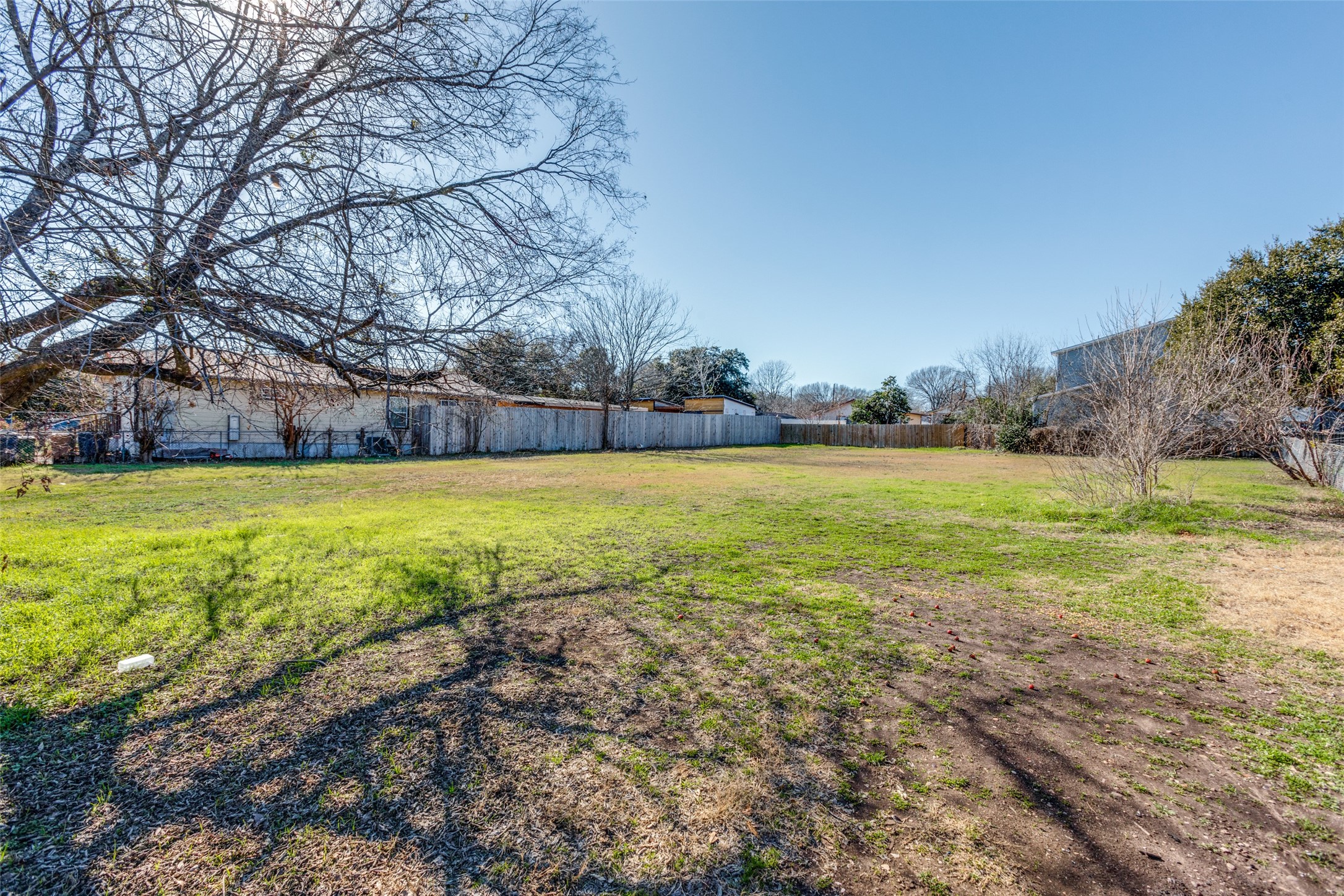 6908 Blessing Avenue Austin, TX 78752 - Photo 11 of 13 a view of a swimming pool and trees in the background