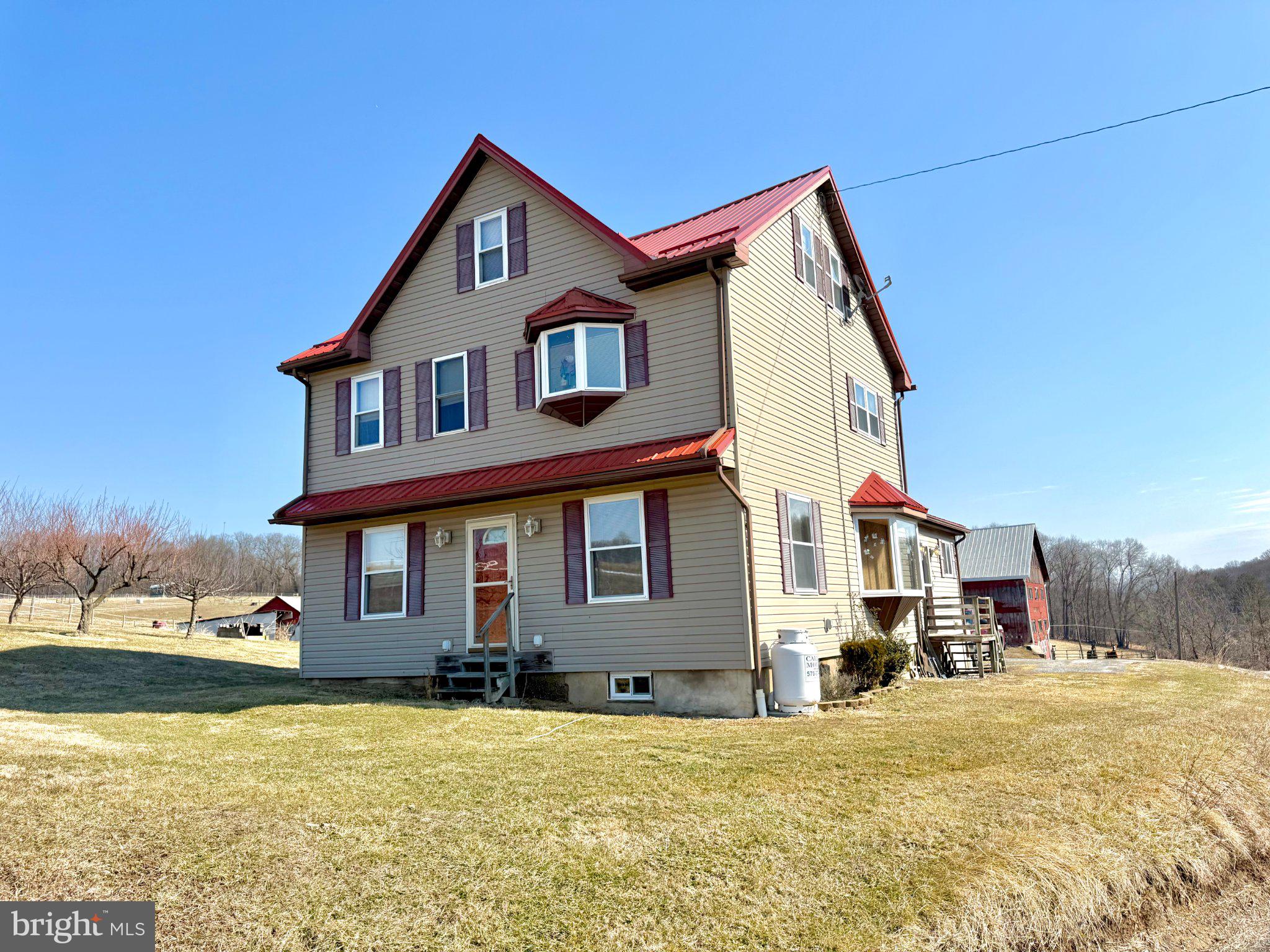 810 Mile Run Road Sunbury, PA 17801 - Photo 3 of 4 a front view of a house with a yard