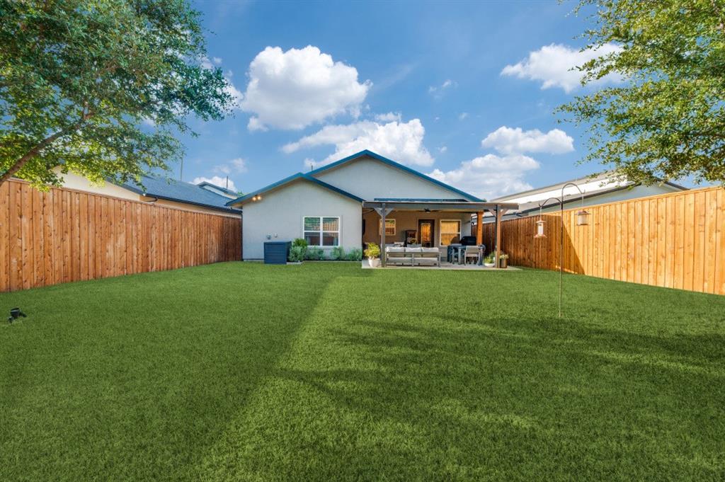 1110 Claude Street Dallas, TX 75203 - Photo 12 of 12 a view of an house with backyard space and garden view