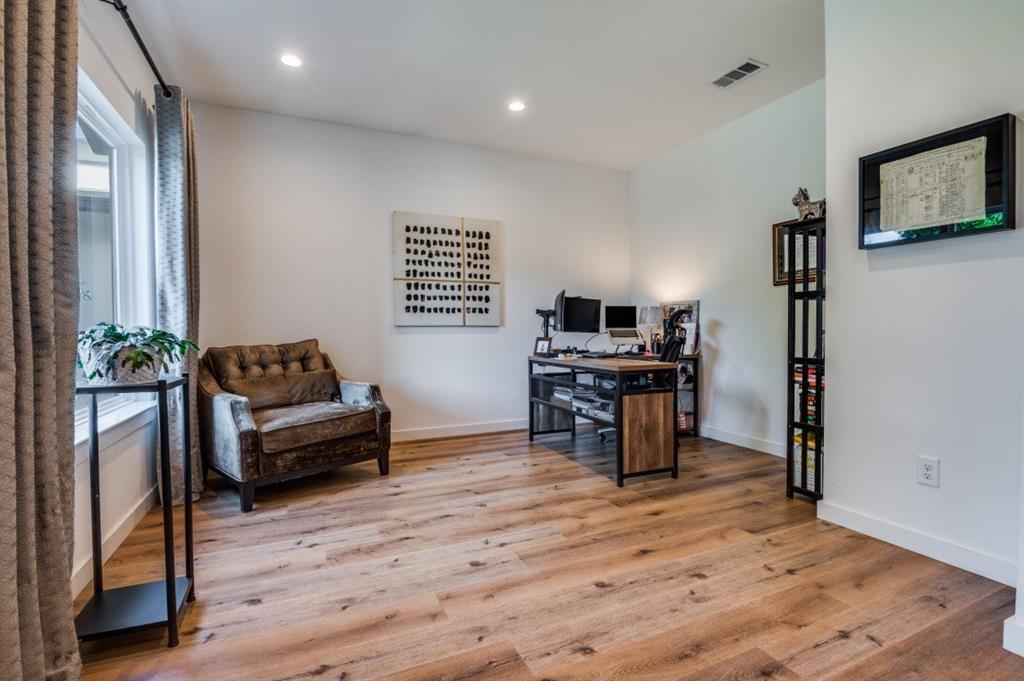 1110 Claude Street Dallas, TX 75203 - Photo 6 of 12 a living room with furniture and a wooden floor