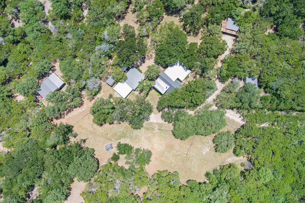 15988 Wortham Bend Road China Spring, TX 76633 - Photo 2 of 40 Aerial perspective showcasing multiple structures surrounded by extensive natural tree coverage