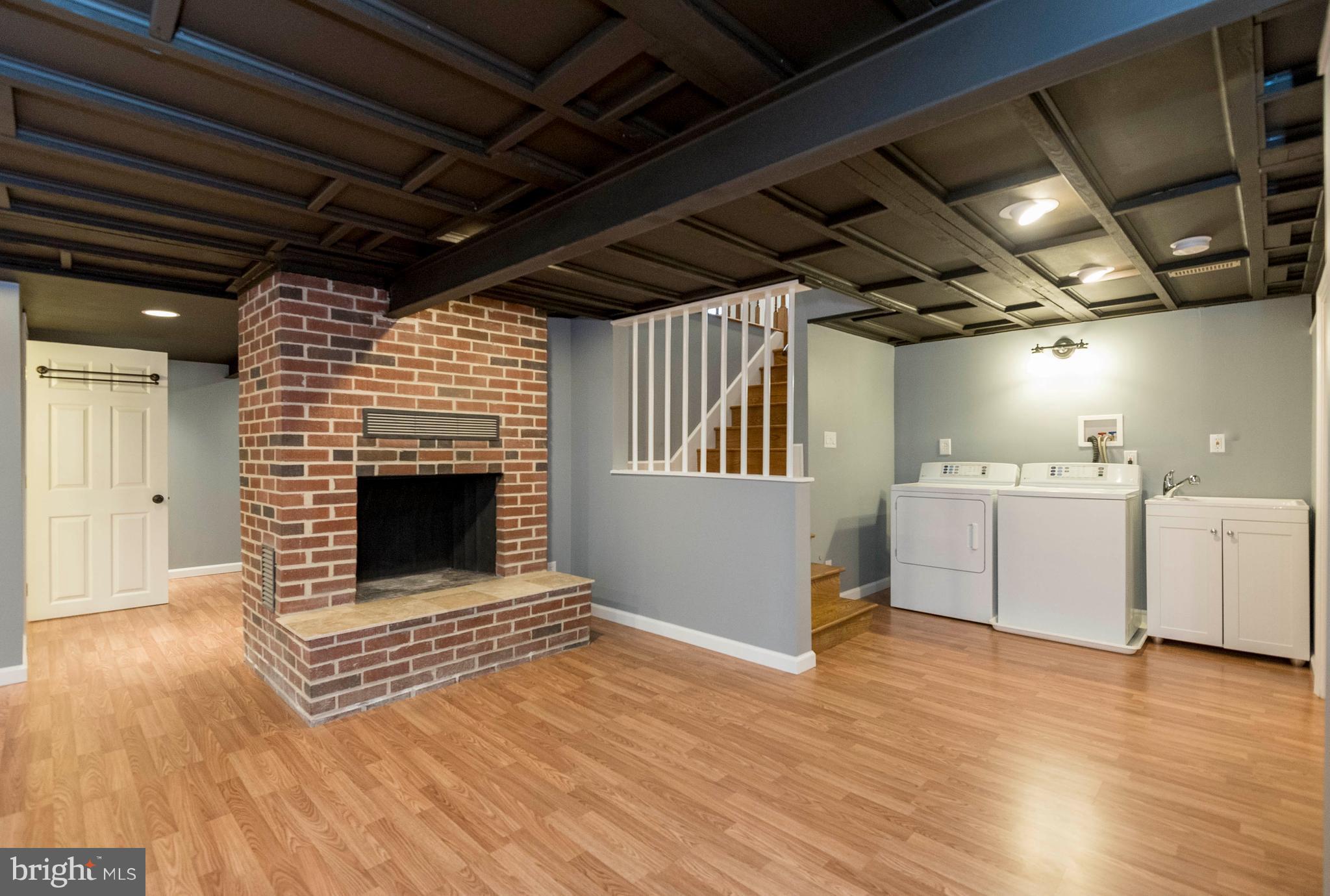 6187 Hanover Road Hanover, MD 21076 - Photo 22 of 28 a view of kitchen and utility room with wooden floors