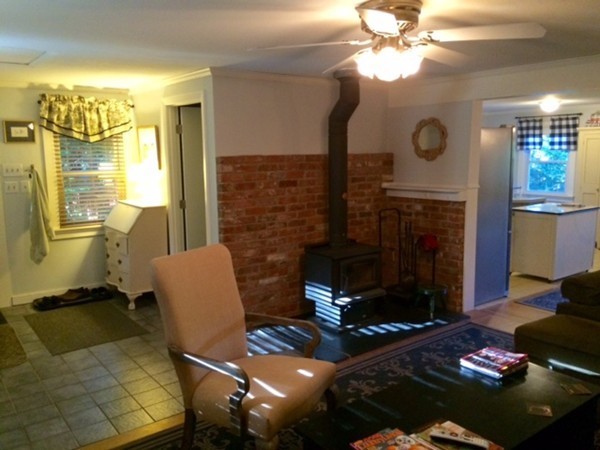 176 South Chesterfield Road Goshen, MA 01096 - Photo 3 of 21 a living room with furniture and a fireplace