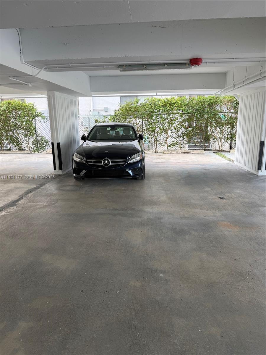 8305 Crespi Boulevard, Unit 5A Miami Beach, FL 33141 - Photo 3 of 4 a view of a car parking garage