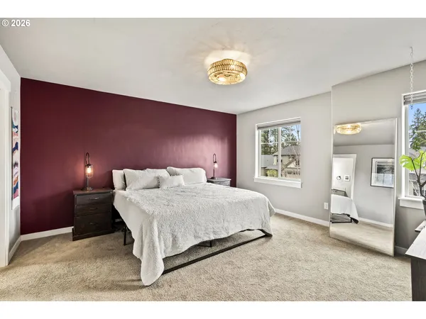 a bedroom with a bed and a table