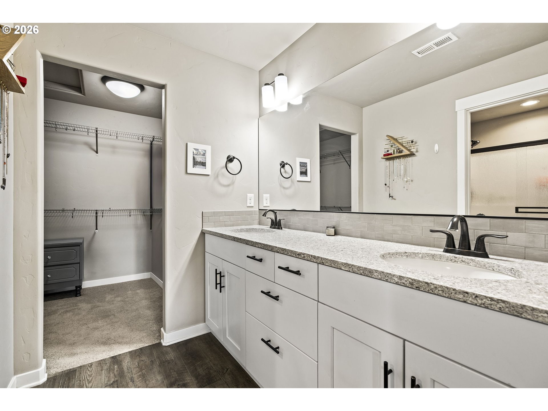 60439 Hedgewood Lane Bend, OR 97702 - Photo 15 of 44 a bathroom with a granite countertop sink mirror and double