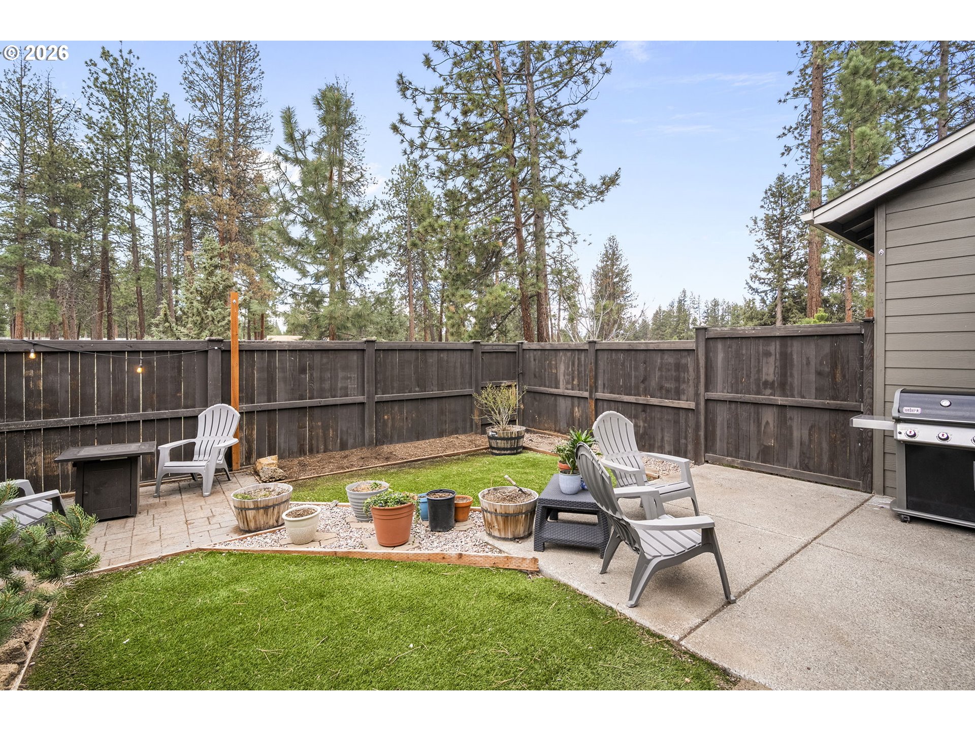 60439 Hedgewood Lane Bend, OR 97702 - Photo 25 of 44 a view of a backyard with sitting area
