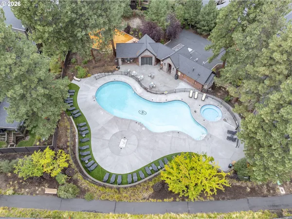 an aerial view of a house with garden space sitting space and swimming pool